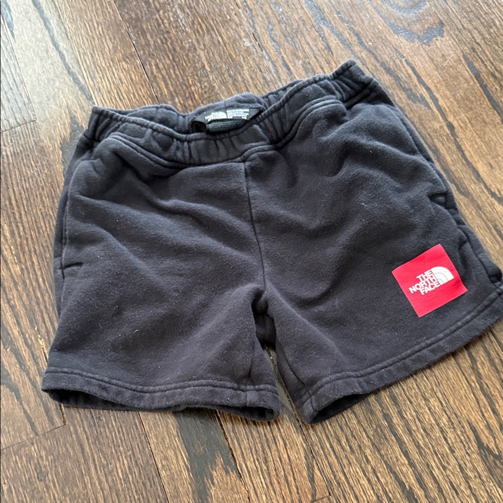 The North Face Black Kids Fleece Shorts with Red Logo Patch